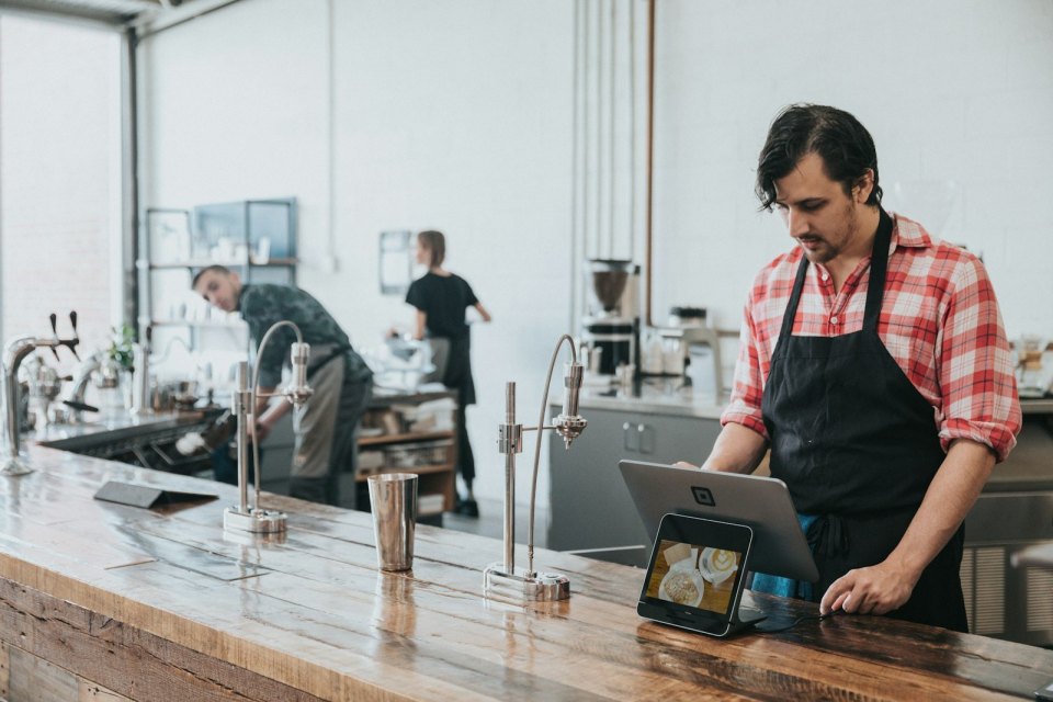 A barista at a cafe counter