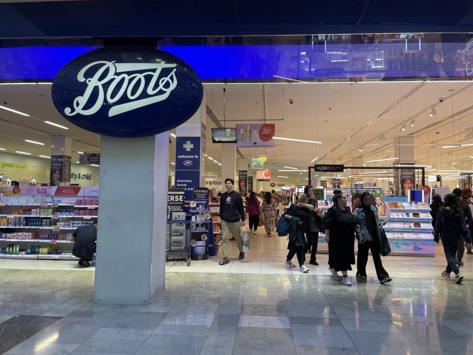 Entrance to a Boots pharmacy in a UK shopping centre, baby and child aisle sign