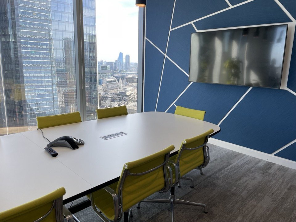 Meeting room with a table and screen
