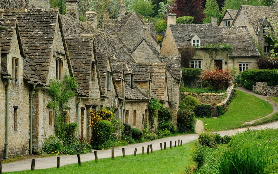 The stone lane of Arlington Row with 17th-century cottages in Bibury, Cotswolds