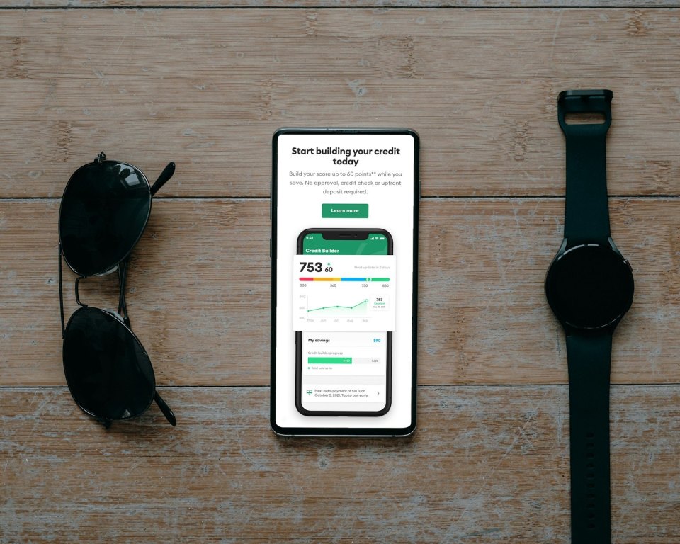 A phone showing a credit score app