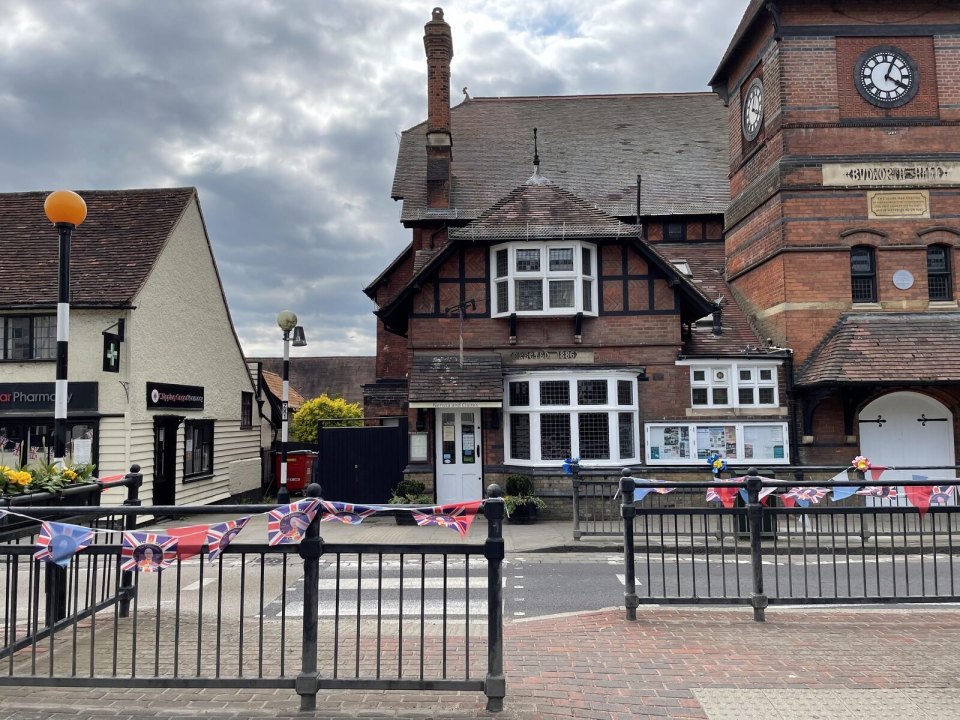The centre of an English town with an old clock building