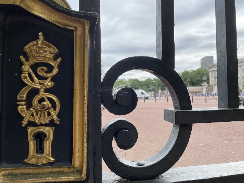 Wrought iron gates with a royal cypher in London