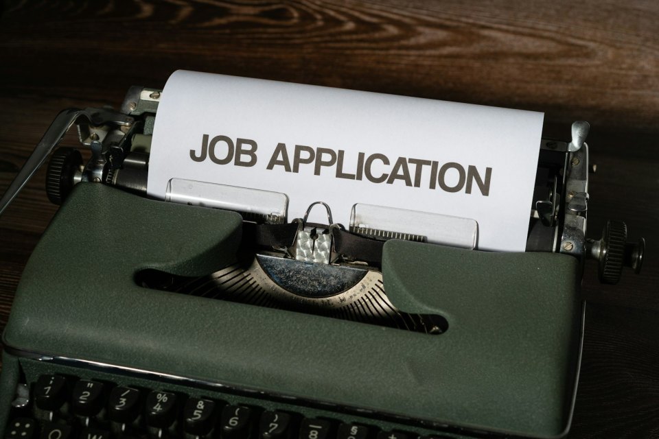 A typewriter with a «JOB APPLICATION» sheet