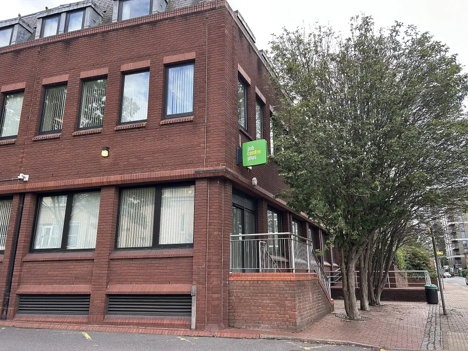 The entrance to a Jobcentre Plus branch with its sign