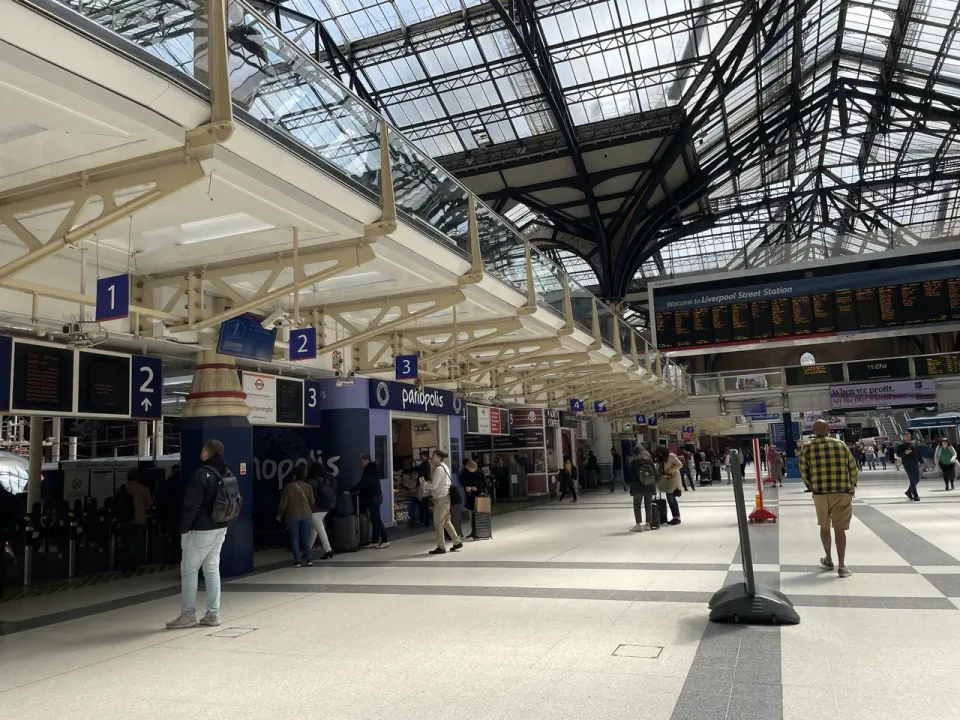Liverpool Street station concourse in London with passengers walking