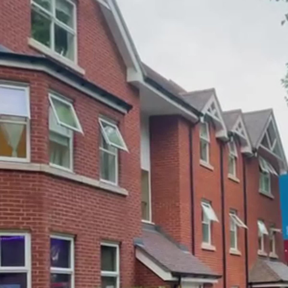 A modern red-brick residential block in the UK