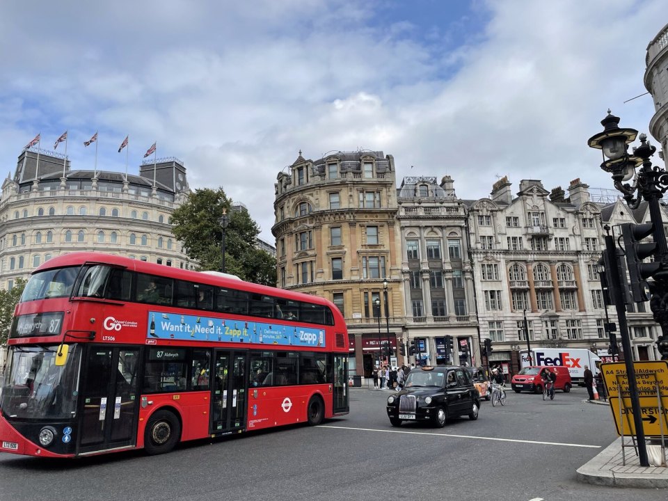 A red double-decker bus on a London street