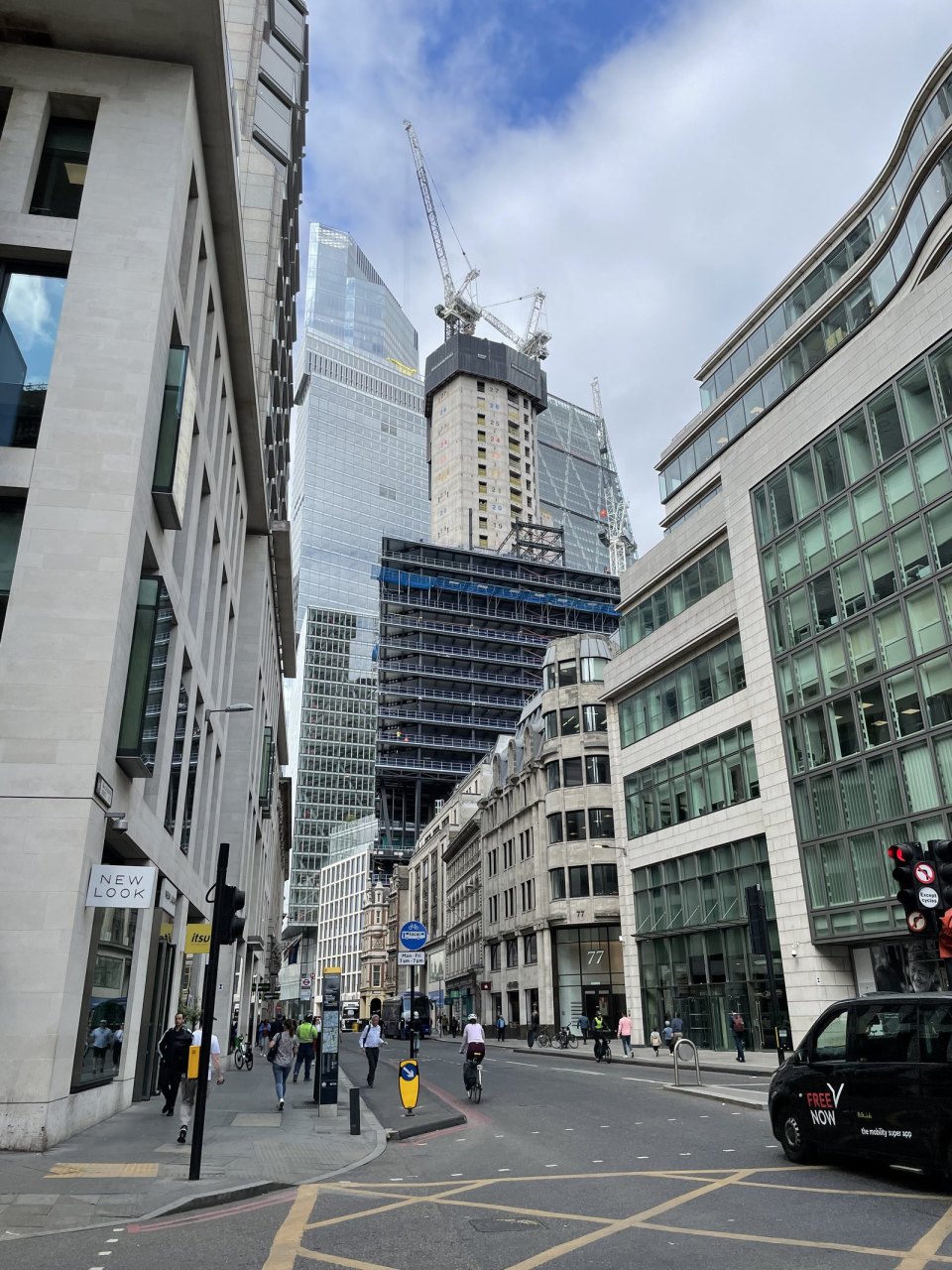 A business street in the City of London with glass offices