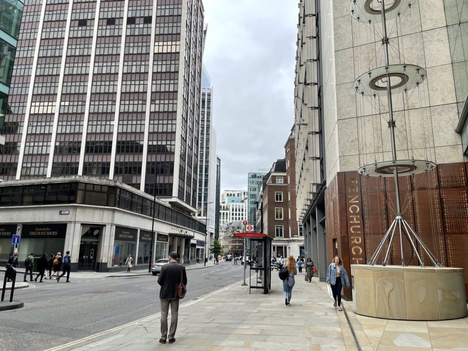 People walking to work on a street in the City of London