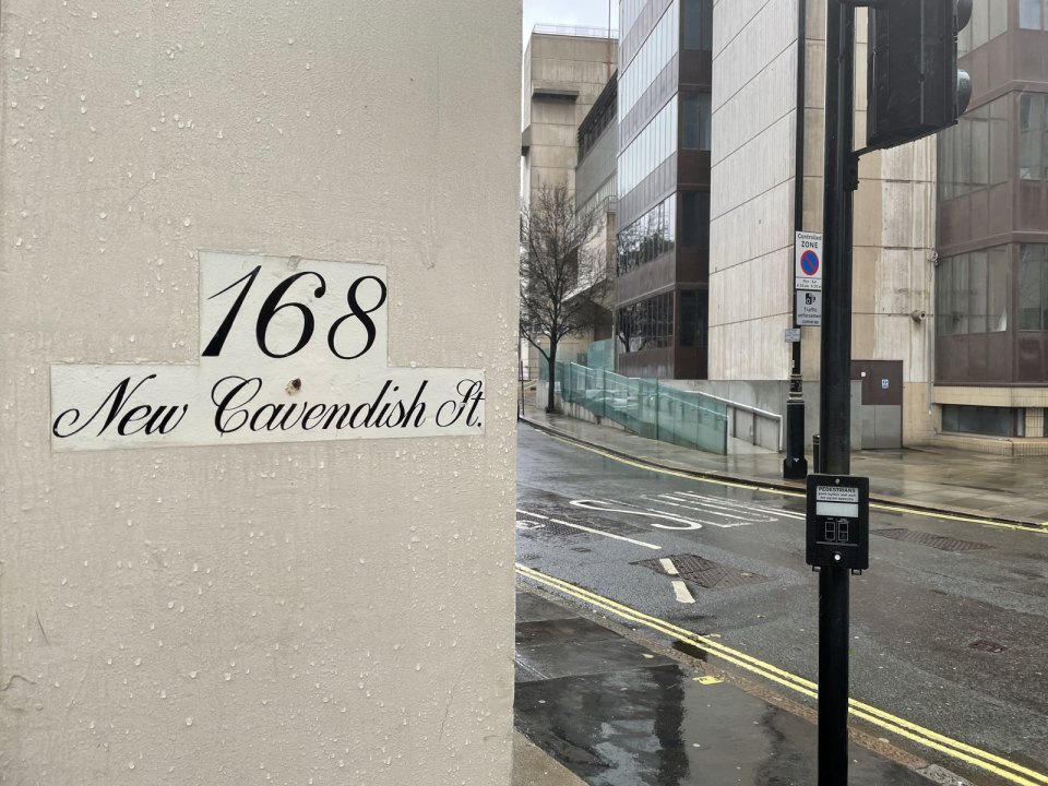 The corner of a modern building on a central London street