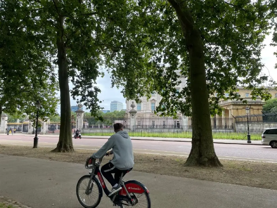 Morning in a London park, a cyclist on the path