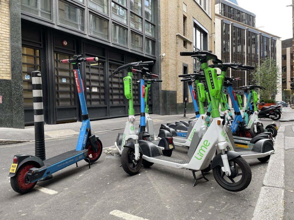Rental e-scooters parked on a London street