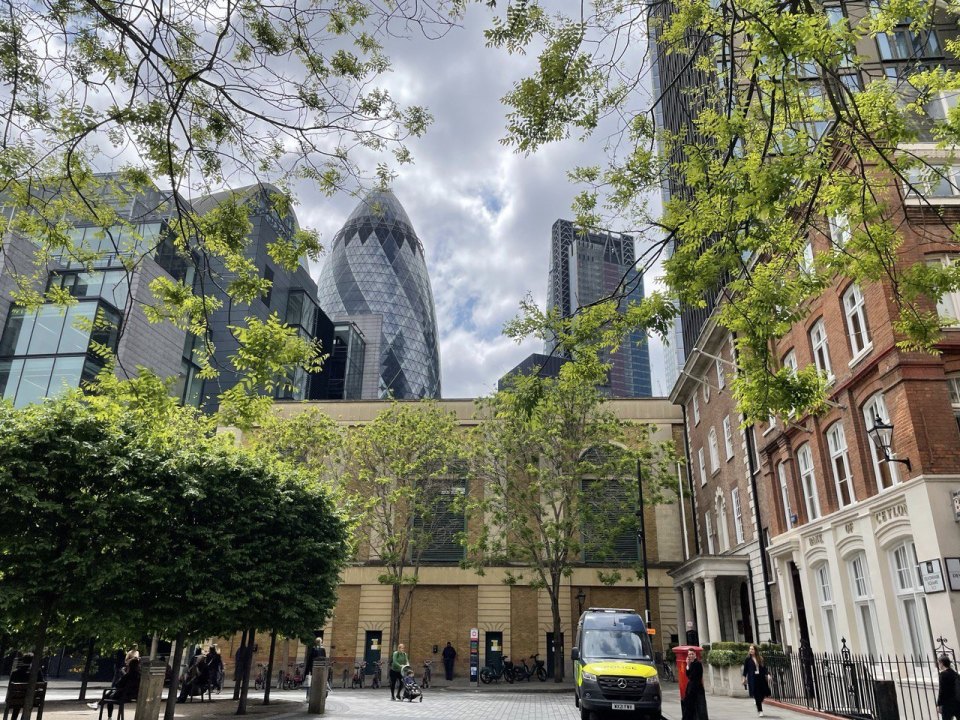 London street with brick buildings and trees