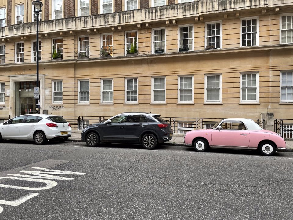 A Georgian street in Marylebone with parked cars