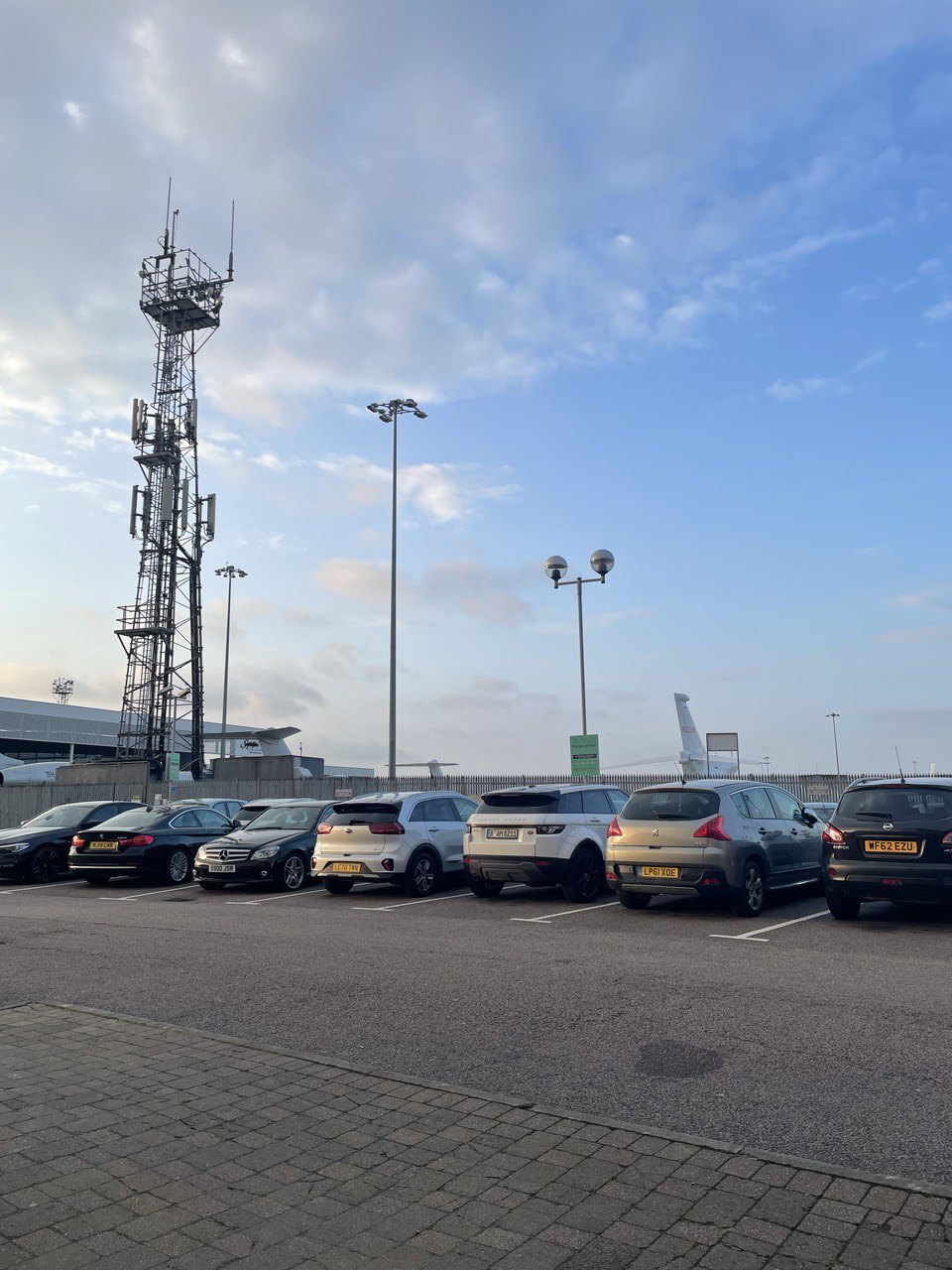 A mobile communications mast against the sky in the UK