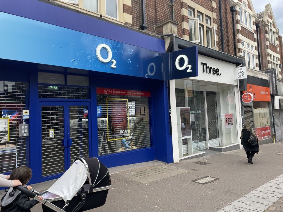 O2 and Three mobile phone shops on a British high street