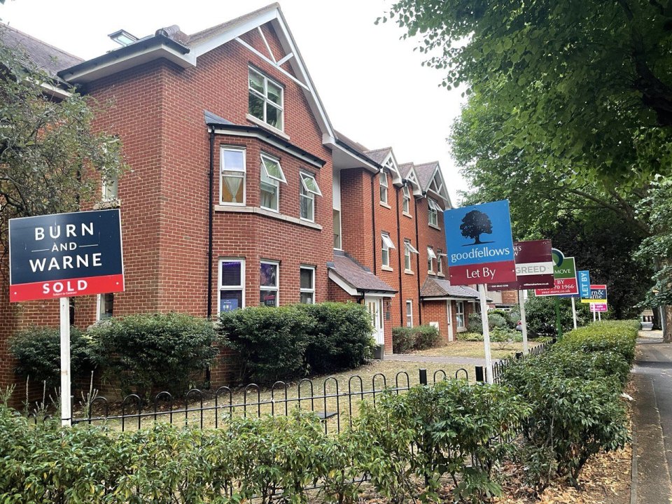 Brick homes in the UK with Sold and Let By signs outside