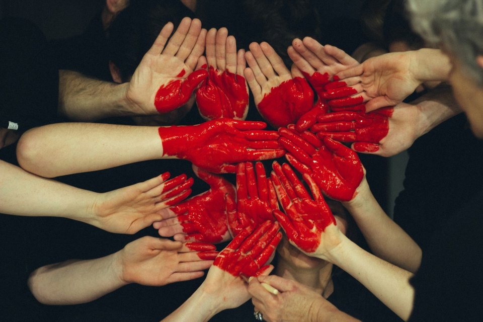 Hands forming a red heart