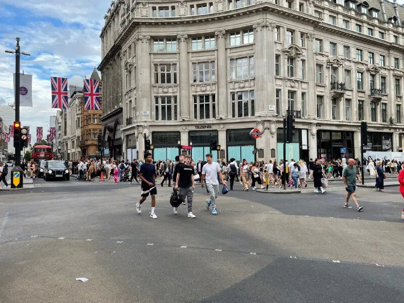 A crowd crossing at Oxford Circus in London