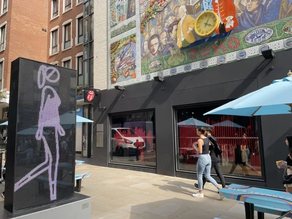 Colourful street mosaic and street art on a wall in London