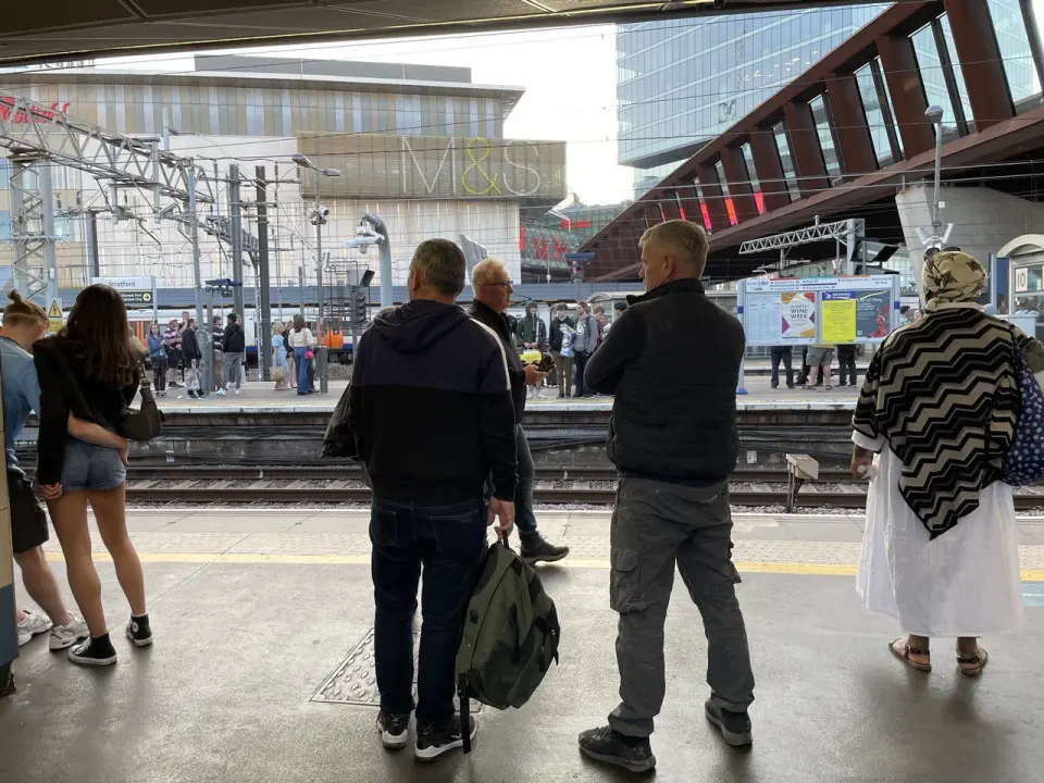 Passengers on a London station platform