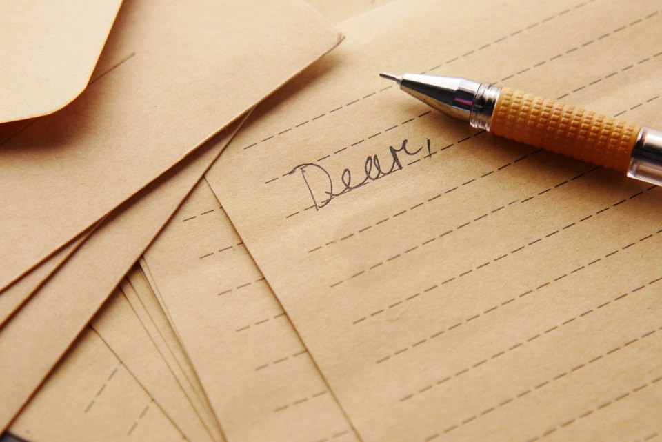 A letter and pen on a desk