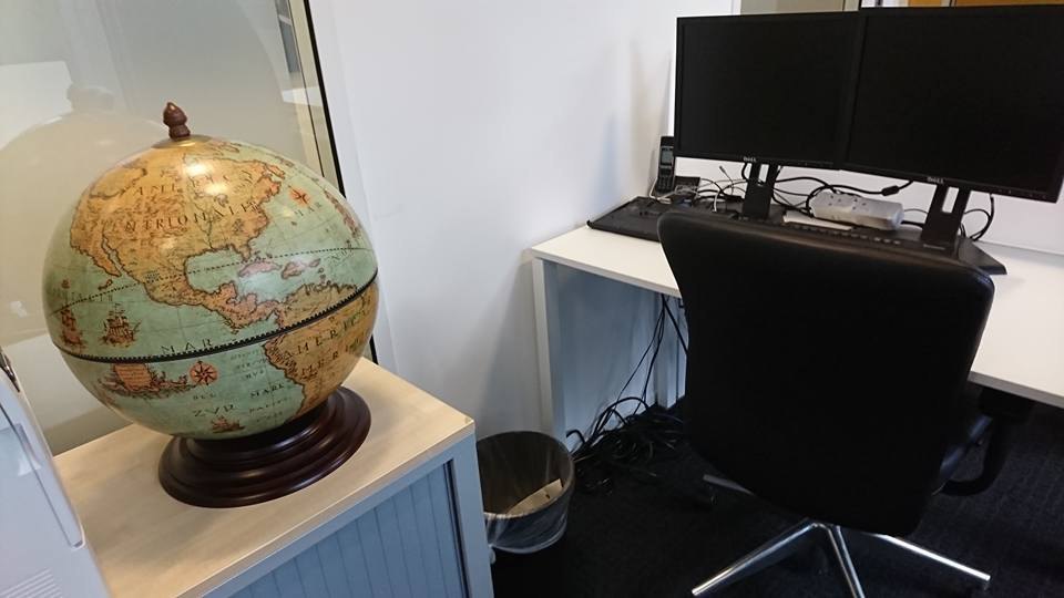A desk with a computer monitor