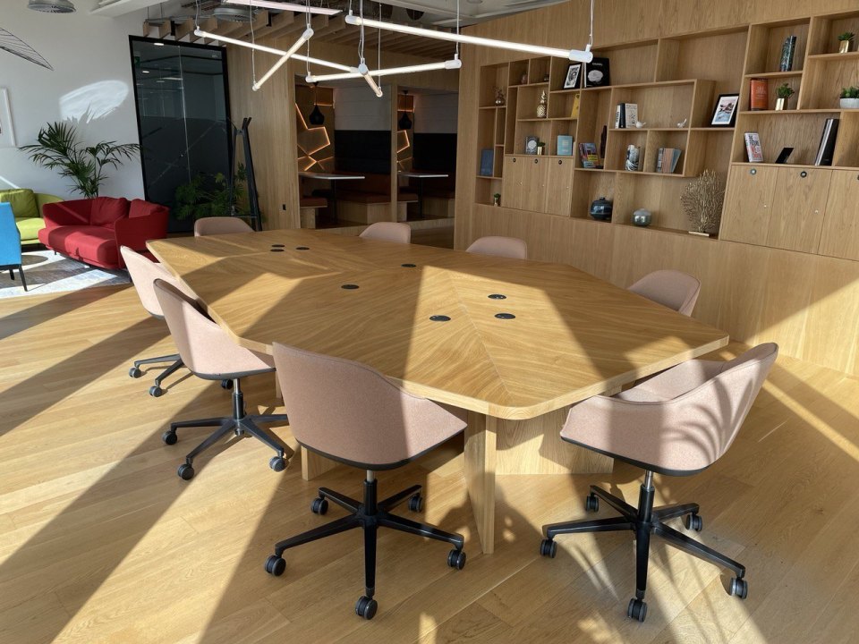 An office with a round table and chairs