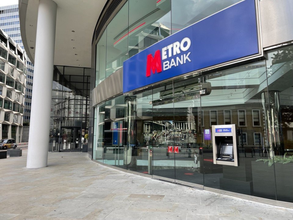 A bank branch with a glass frontage and a cash machine