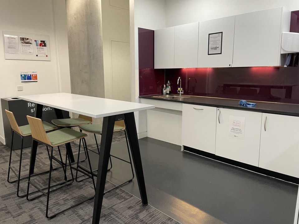 Kitchen area with a sink and mixer tap