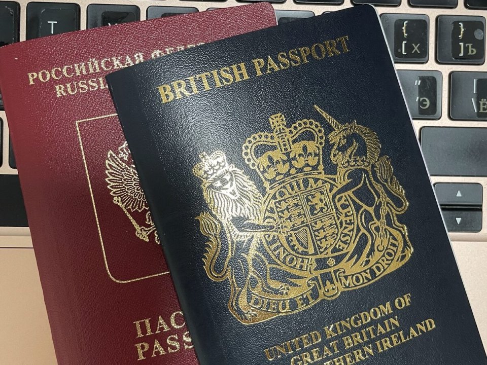 A British passport on a laptop keyboard