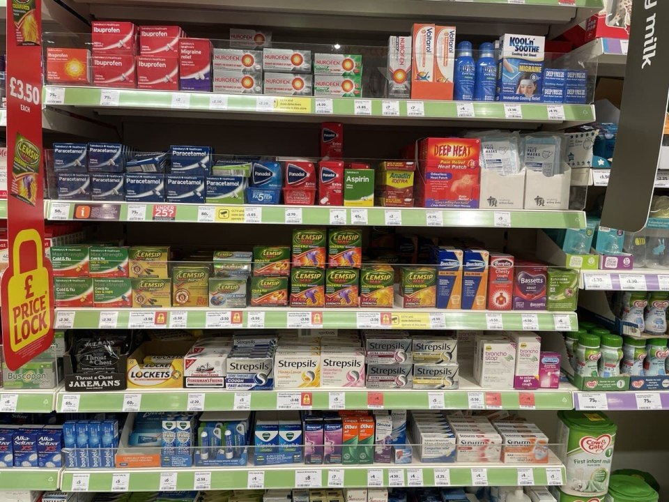 Shelf of over-the-counter cold remedies in a UK supermarket