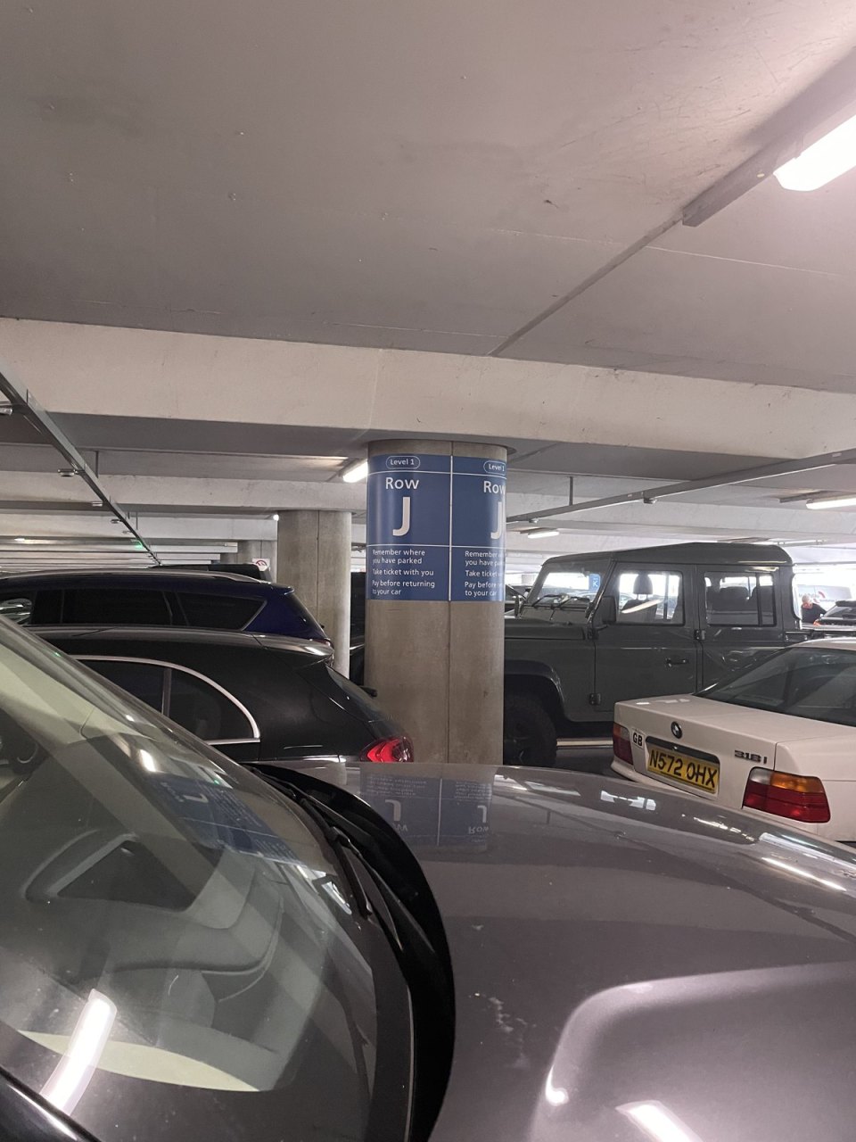 An underground car park with rows of cars