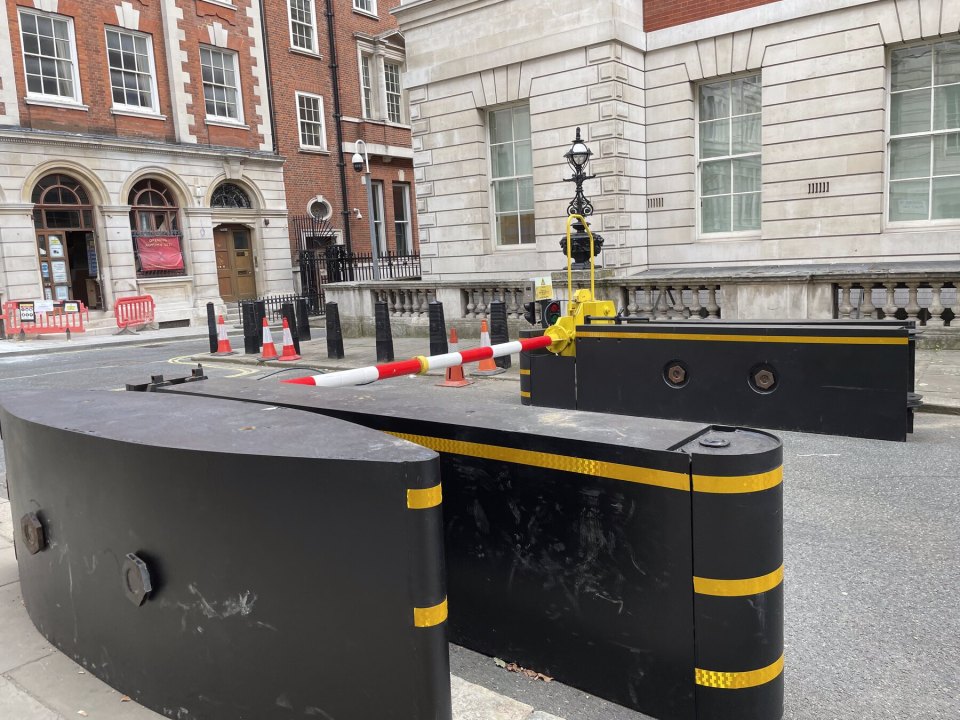 Road barriers and cones outside government buildings in Whitehall, London