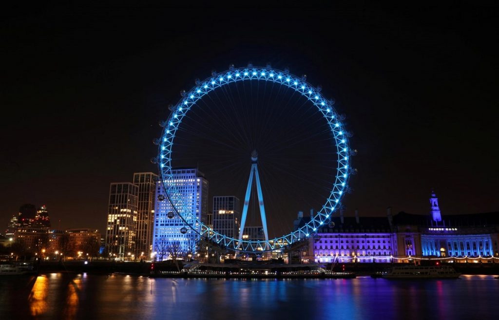The London Eye is pictured lit blue in support of the NHS, as the spread of the coronavirus disease (COVID-19) continues